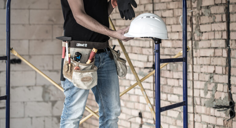 builder-handyman-with-construction-tools-house-an-2021-09-02-11-01-28-utc
